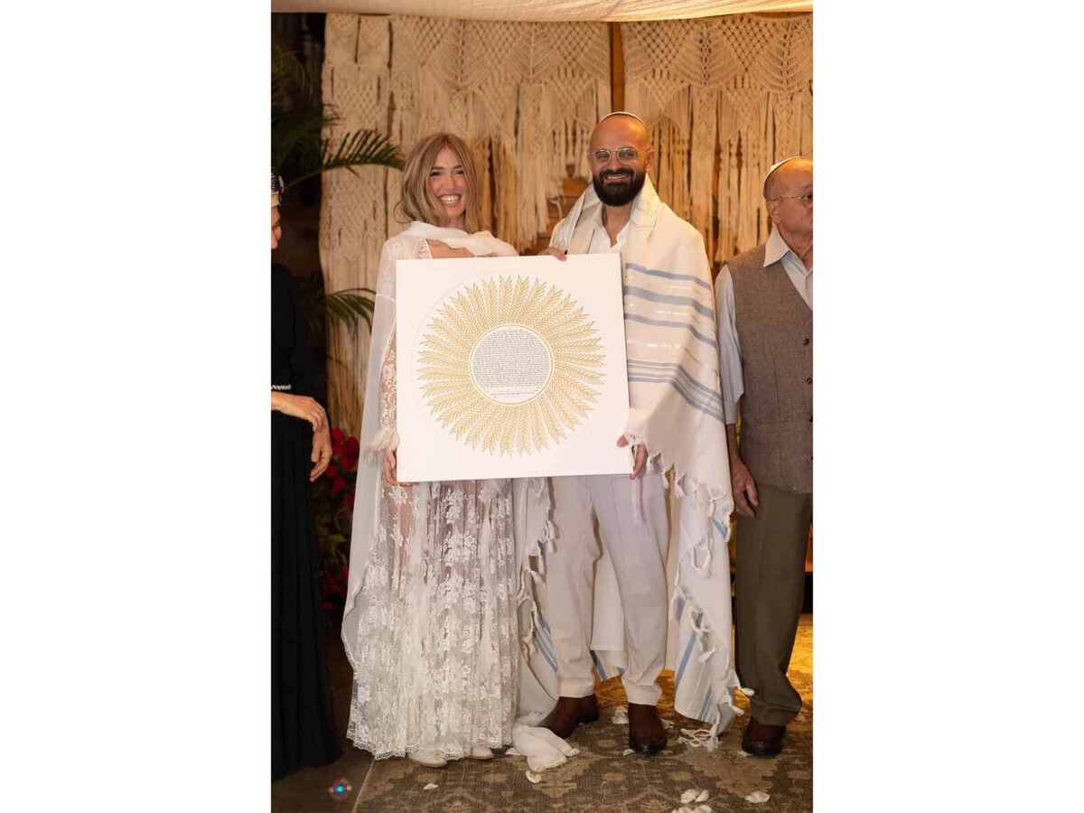 Palm Ketubah papercut design with radiating palm leaf motif and circular text center