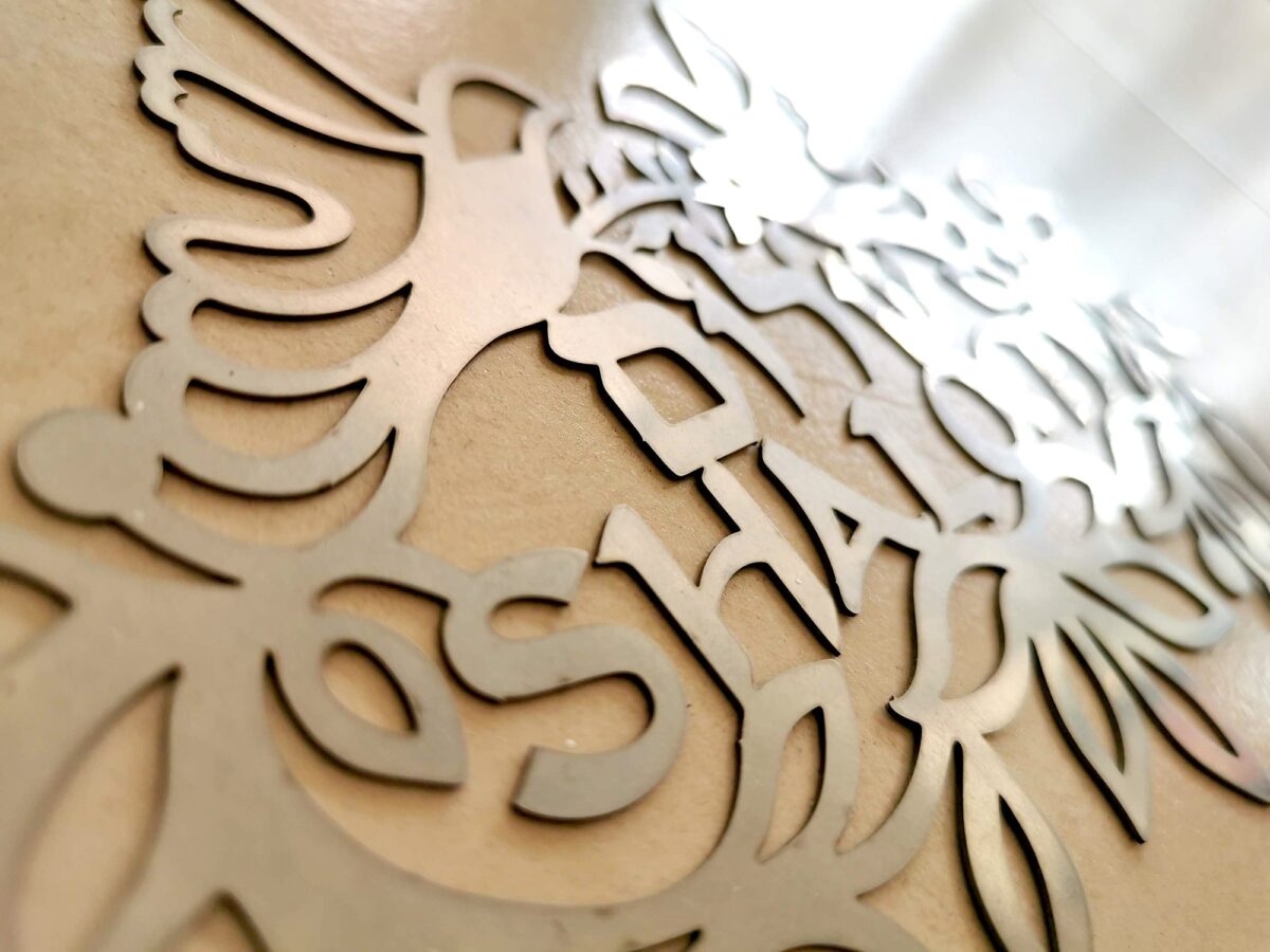 Shalom sign metal cut detail