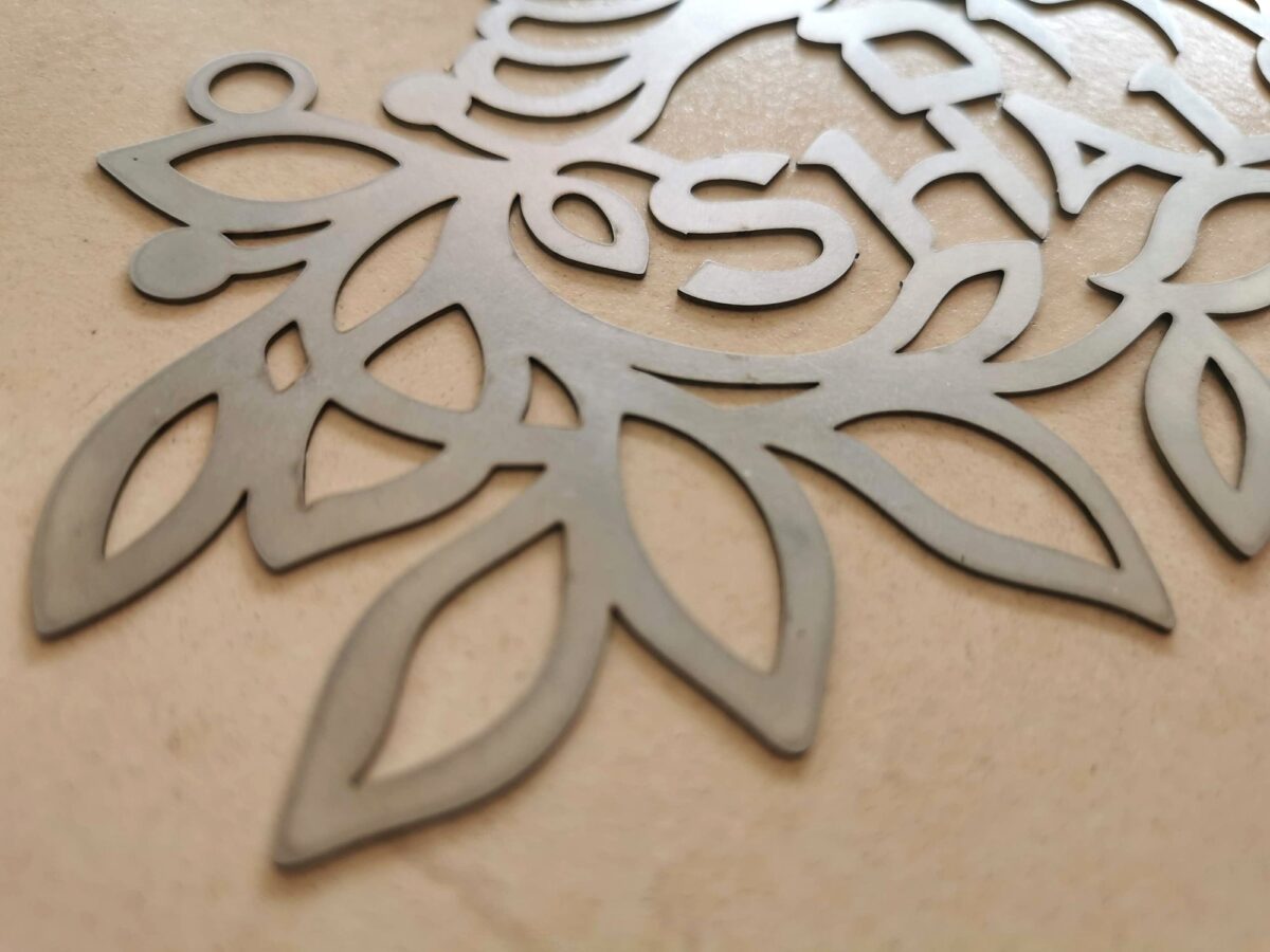Shalom sign metal cut detail