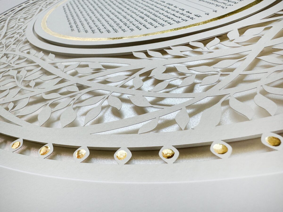 Golden Eden Ketubah papercut with tree design and hand-painted gold details