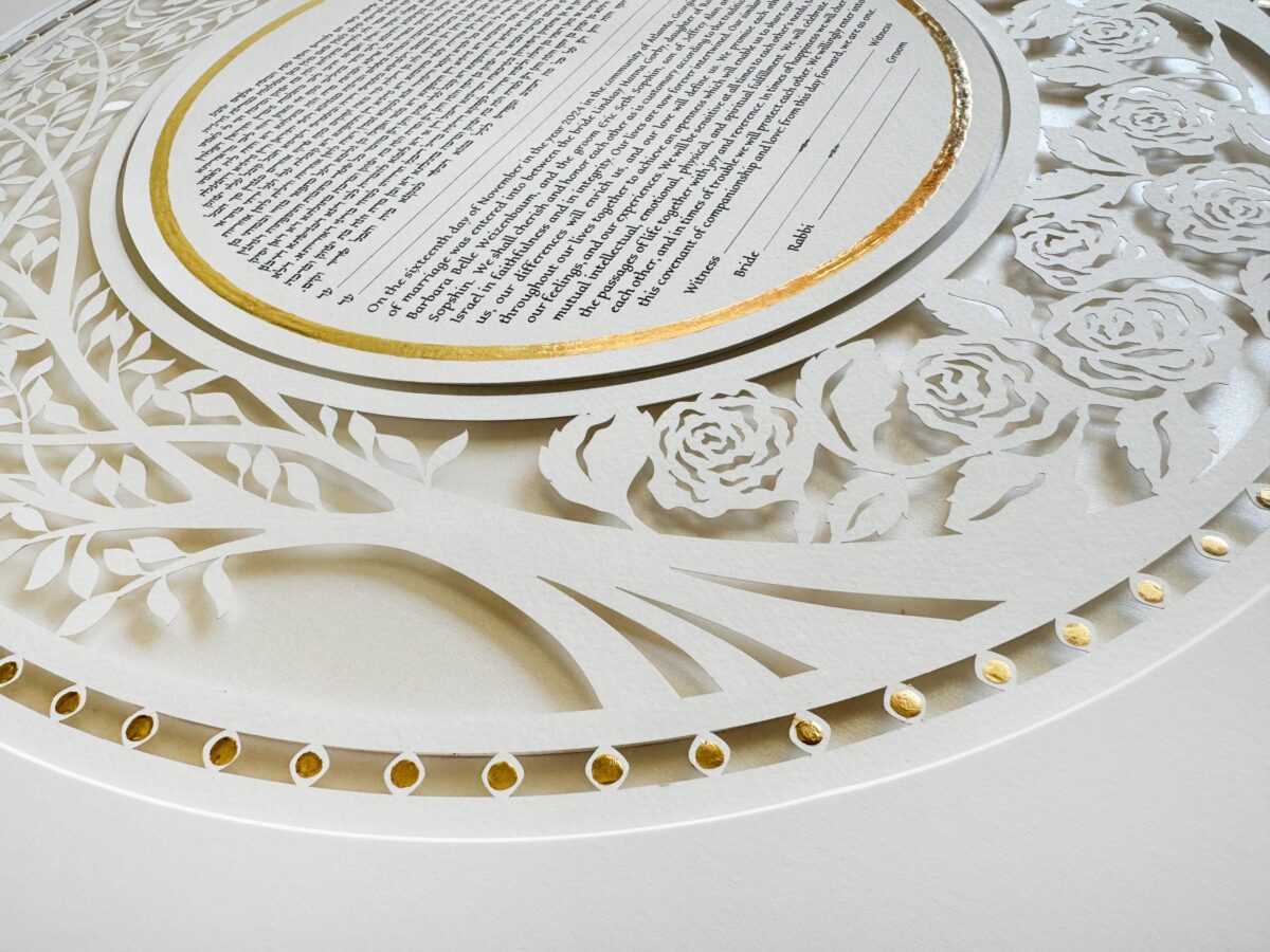 Golden Eden Ketubah papercut with tree design and hand-painted gold details