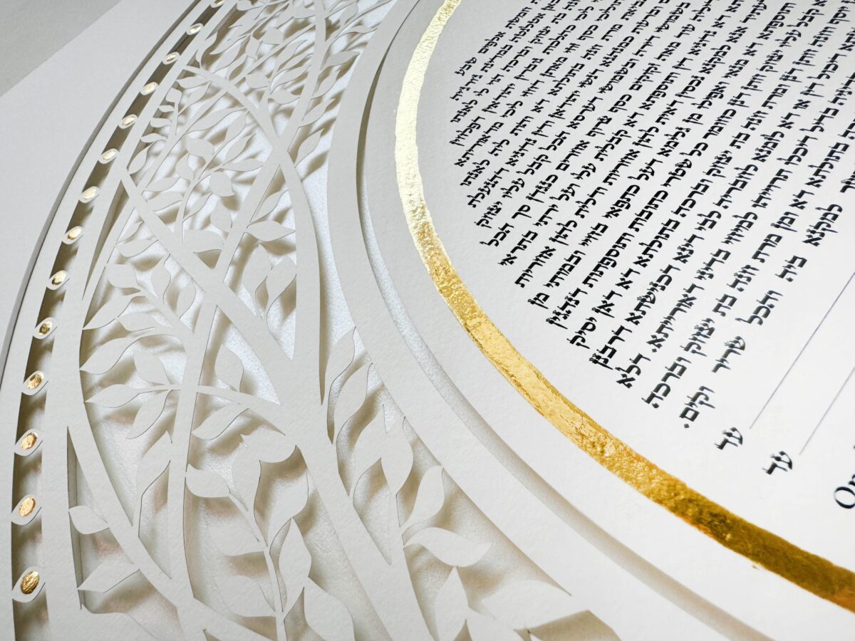 Golden Eden Ketubah papercut with tree design and hand-painted gold details