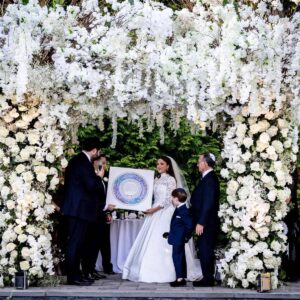 Golden Heavenly Ketubah circular papercut design with blue watercolor background and gold accents